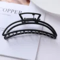 Close-up detail shot of a minimalist black metal hair claw clip showcasing geometric hollow design. - Geometric Semicircle Metal Claw Clip (67#)