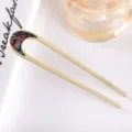 Detailed view of matte gold U-shaped hair fork with colorful shell inlay, elegant hair accessory. - 10.4cm / Iridescent