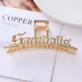 Golden metal hair claw clip with gothic letter design, perfect for secure and stylish ponytails. - 28# Gold Gothic Letter Style / Individual Packaging / 11.6cm