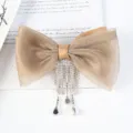 Detail view of the elegant champagne organza bow hair clip featuring shiny rhinestone fringe. - Style 2 Khaki Bowknot Spring Clip / L
