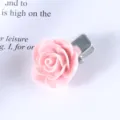 Pink rose hair clip detail showing delicate floral design and silver metal clip base. - Flower Shape / Pink