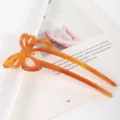 Close-up detail of the amber acetate hollow butterfly hair stick showcasing fine craftsmanship. - Coffee Butterfly Hair Fork (S424) / 11.5cm