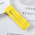 Detail shot of a bright yellow rectangular hair clip, metal side clip for chic daily styling. - 9# Rectangle Style (Bright Yellow)