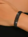 Black rhinestone multi-row claw chain bracelet, elegant wrist jewelry accessory for women. - Bracelet