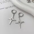 Silver zircon cross dangle earrings, niche design chic fashion ear clips for women detail shot. - Starburst Stud Earrings (1 Pair)
