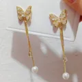 Gold butterfly tassel earrings with sparkling cubic zirconia and pearl pendants for women. - Rhinestone Butterfly Tassel Stud Earrings