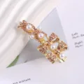 Gold-tone metal hair clip featuring pink rhinestones and white pearls in a delicate bow design. - Bowknot Rhinestone Duckbill Clip / Gold