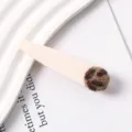 Chic minimalist hair clip featuring matte white resin and cute leopard plush ball. - 18#