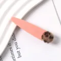 Detail shot of a cute pink resin duckbill hair clip decorated with a chic leopard print pom-pom. - 20#