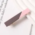 Close-up of a stylish two-tone resin duckbill hair clip, brown and pink color block design. - Brown Pink