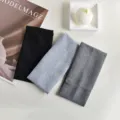 Detailed shot of ribbed knit yoga headbands, showing soft texture and elastic design. - Simple Grey Set