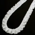 White pleated ruffle ribbon trim detail shot, perfect for doll clothes and DIY sewing crafts. - Width: 2.5cm 3 Yards/Pack / Off White