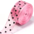 Pink sheer organza ribbon roll featuring cute black heart prints, ideal for DIY bows. - Deep Pink