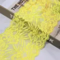 Detail view of bright yellow stretch lace trim fabric, perfect for garments, cuffs, and DIY crafts. - 1.5 Yards (15cm Wide) / Yellow
