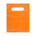 Close-up detail of bright orange PE plastic die-cut handle bag packaging product display. - Size Approx 15x20cm / Orange