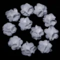 Close-up view of white chiffon flower accessories, perfect for DIY crafts and hair bows. - 10 Pieces/Pack (2cm Diameter) / White