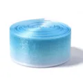 Close-up of light blue gradient sheer organza ribbon roll, delicate texture for gift wrapping. - 2.5CM Wide / Blue