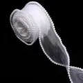 Detail view of a white organza ribbon roll with delicate pearl bead trim for crafts. - 5 Yards/Pack / White