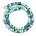 Close up of light green glass wheel spacer beads with blue iridescent finish for DIY crafts. - Half Mint Ceramic-look PVC decoration