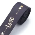 Black polyester ribbon with gold foil love print, ideal for DIY gift wrapping and crafts. - Gray