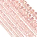 Pink faceted crystal rondelle beads detail shot for DIY jewelry making accessories. - Pink AB