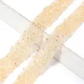Primer plano detallado de cintas de pedrería de resina AB de champán brillante para prendas. - 1.2cm Ancho 2 Yardas/Pack / Amarillo jengibre