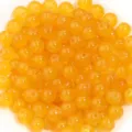 Detail de gros plan de perles en verre jaunes, perles rondes polies en vrac pour le bricolage. - Jaune Moyen