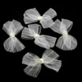 Detailed shot of white organza pleated bows, perfect craft accessories for clothing and gift packaging. - Large Bow Accessory (F6292) / Beige