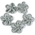 Close-up detail of silver fabric five-petal flower DIY accessories, glossy texture. - 5 Pieces/Pack (6-7cm) / Green