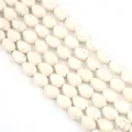 White turquoise pear shaped loose beads close up detail for DIY bracelets and necklaces. - Straight Hole Flat Melon Seed Style / 12x8mm (Approx. 29 Pcs) / White