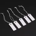 Blank white hang tags with elastic strings for jewelry, clothing, and retail display price cards. - Blank Hang Tag / 25*10mm (100 Pieces/Pack) / White