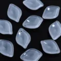 Detail view of translucent glass petal shaped DIY jewelry beads for earrings and hairpins. - White Epiphyllum