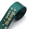 Dark green polyester ribbon featuring gold hot-stamped happy birthday text, detail shot. - Dark Green