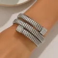 Silver multi-layer wrap bracelet with rhinestone accents, stylish geometric open design. - Silver