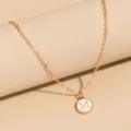 Gold-tone initial letter M pendant necklace, elegant enamel charm design for daily wear. - Letter M