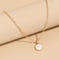 Minimalist gold chain necklace with a white enamel round letter N pendant for daily wear. - Letter N