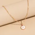Gold-tone chain necklace featuring a white enameled round pendant with letter R charm. - Letter R