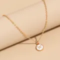 Gold initial letter W pendant necklace with white enamel detail for stylish everyday wear. - Letter W