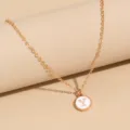 Minimalist gold chain necklace featuring a white enamel round letter Y initial pendant. - Letter Y