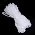 Detailed view of white pom pom trim, ideal for sewing, garment accessories and DIY crafts. - Width 1cm 10 Yards/Pack / White