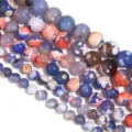 Primo piano dettagliato di perle di agata bicolore fiamma naturale per gioielli fai-da-te. - Diametro 6mm, Foro 0,8mm (circa 60 perle) / Motivo a fiamma bicolore blu e arancione