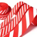 Red and white striped grosgrain ribbon rolls for DIY gift wrapping, bows, and holiday decor. - 0.6cm Width 10 Yards / Red