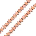 Close-up detail of copper electroplated star hematite loose beads for DIY jewelry making. - Brown