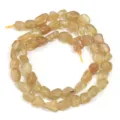 Vista detallada de hilo de cuentas irregulares de cristal amarillo natural para joyas DIY. - Aprox. 45 Piezas/Paquete / Apatita Amarilla