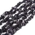 Close-up detail shot of sparkling blue sandstone chip beads, ideal for DIY jewelry making. - Length 80cm Approx 220 Beads / Blue Sandstone Chips