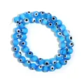 Detail shot of blue evil eye glass round beads strand for DIY jewelry making accessories. - Diameter 4mm Hole 0.8mm (Approx 90 Pcs) / Transparent Blue