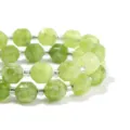 Variante bracciale con perle di pietra verde sfaccettate e distanziatori argentati. - Diametro 10mm (circa 30 pz) / Peridoto
