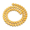 Nahaufnahme von goldenen Herz-Hämatit-Perlen, ideal für DIY-Schmuckherstellung und Basteln. - Galvanisiertes Herzgold