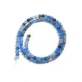 Close-up detail of blue agate round beads strand, perfect for DIY jewelry crafting. - Round Bead (T5187) / 4mm