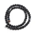 Close-up detail of black striped agate round beads, natural gemstone semi-finished diy strand. - 6mm (Approx. 60pcs) / Black Striped Agate (Color May Vary by Batch)